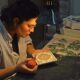 Painting a tile at the ceramics workshop